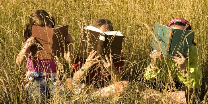 three sitting and reading