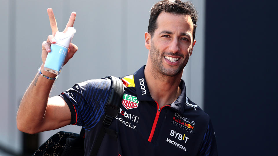 Daniel Ricciardo smiles at the camera.