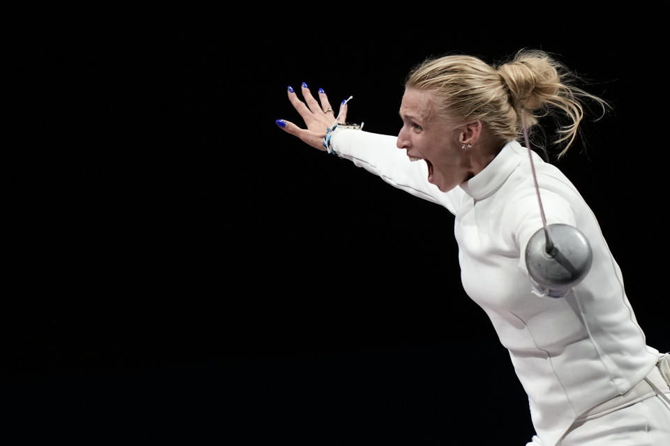 Katrina Lehis of Estonia celebrates after winning the Women's Epee team final at the 2020 Summer Olympics, Tuesday, July 27, 2021, in Chiba, Japan. (AP Photo/Andrew Medichini)