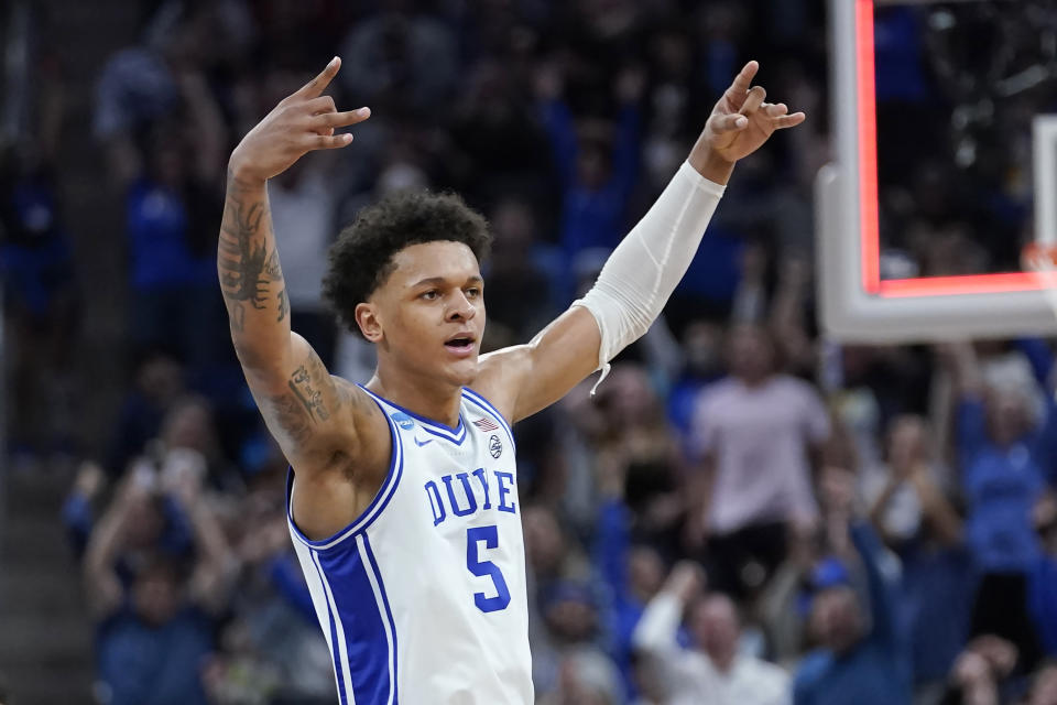 FILE - Duke forward Paolo Banchero celebrates during the first half of a college basketball game against Arkansas in the Elite 8 round of the NCAA men's tournament in San Francisco, Saturday, March 26, 2022. Houston, Detroit and Orlando share the best odds to win the draft lottery on Tuesday, May 17, 2022, and the No. 1 pick in the NBA draft. All three are already loaded with young players, even before the possibility of adding someone like Chet Holmgren, Paolo Banchero or Jabari Smith. (AP Photo/Marcio Jose Sanchez, File)