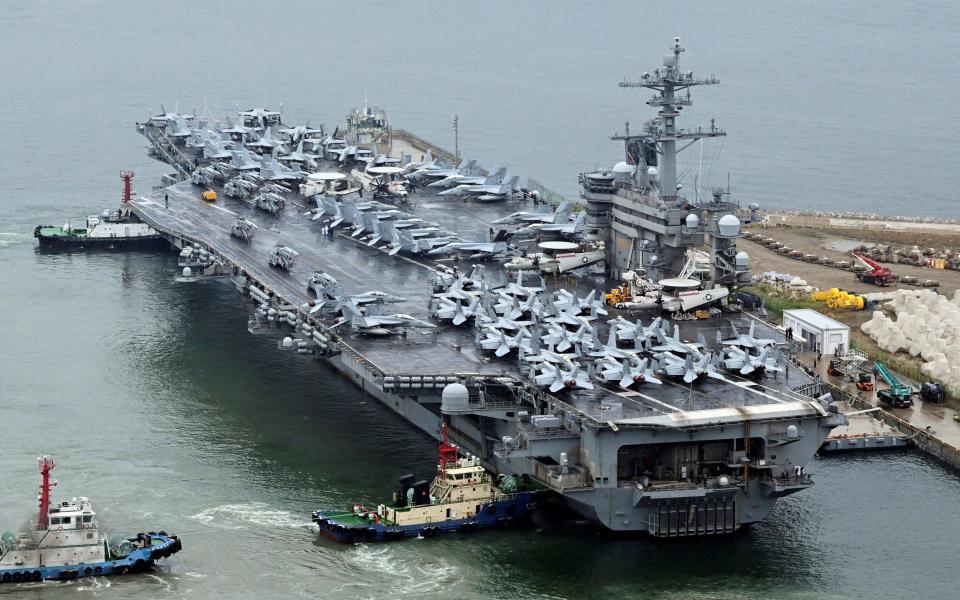 The Theodore Roosevelt, a Nimitz-class nuclear-powered aircraft carrier, arrives in Busan