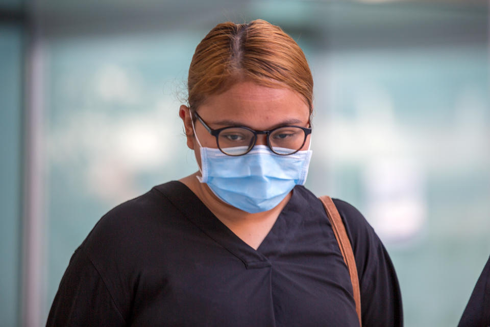 Siti Wan Su'Aidah Samsuri, 25, seen arriving at the State Courts on 21 April 2020. (PHOTO: Dhany Osman / Yahoo News Singapore)