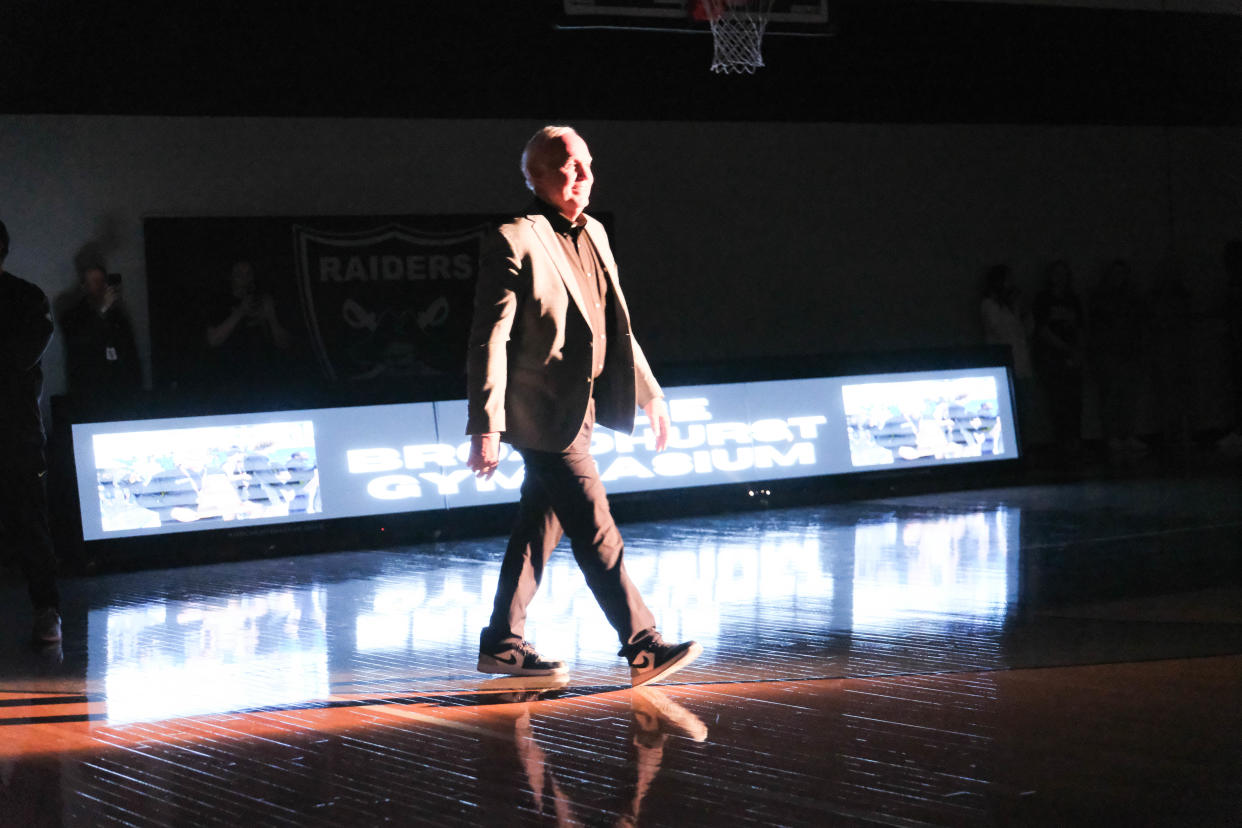 Randall High School basketball coach Leslie Broadhurst walks onto the newly named Leslie Broadhurst Gymnasium at Randall High School.