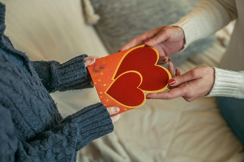 A mother and daughter prepare to celebrate Valentine's Day together during a pandemic. (Image via Getty Images)