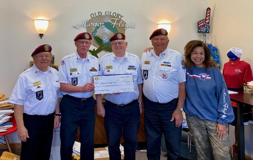 Members of Vietnam Veterans of America, Chapter No. 731, Manitowoc County, presented a big check to the Old Glory Honor Flight of Northeast Wisconsin. From left are members Steve Noworatzky, St. Nazianz; Marv Decker, Two Rivers; Harold A. Olson Jr., Manitowoc; Ken Wentker, Mishicot; and representative Diane Macdonald. Absent is Mike Flentge, Orange Blossom sale chairman. Each year, the proceeds from the Orange Blossom Sale, which is held at the end of March in conjunction with National Vietnam War Veterans Day (March 29), are donated to a special cause and this was the recipient in 2024.