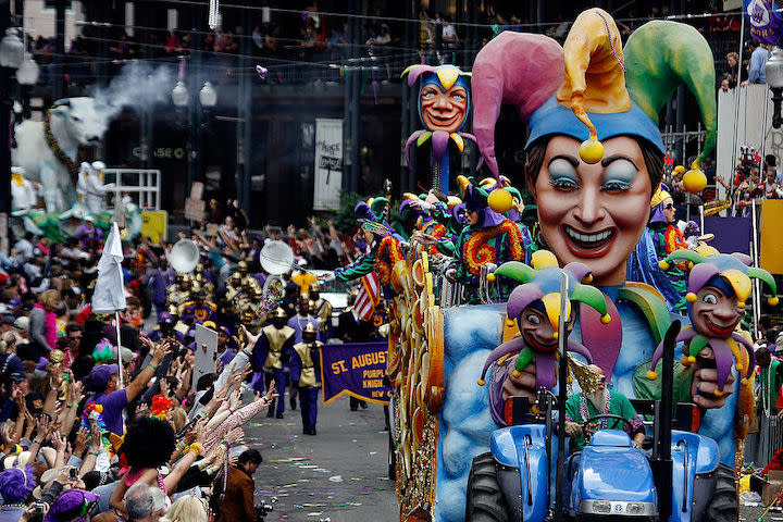 People walking in the street in New Orleans - Best cities for Memorial Day Weekend