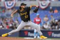Pittsburgh Pirates' Jared Jones delivers a pitch during the first inning of a baseball game against the Miami Marlins, Saturday, March 30, 2024, in Miami. (AP Photo/Wilfredo Lee)