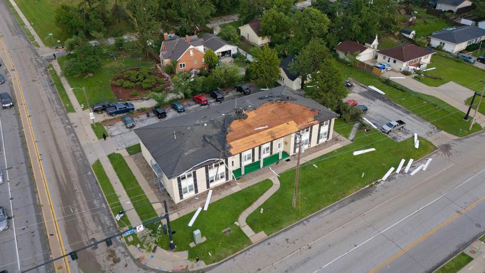 Shingles are torn off the roof of an apartment building at 63rd Street and Hickman Road in Des Moines after a storm on July 15, 2024.