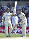 New Zealand's Tom Latham, left, celebrates after scoring half century alongside New Zealand's Kane Williamson during the third day of the third cricket test match between England and New Zealand at Headingley in Leeds, England, Saturday, June 25, 2022. (AP Photo/Rui Vieira)