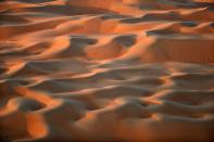 <p>The Liwa desert is the magnificent setting for the annual Moreeb Dune Festival. (Photo: Karim Sahib/AFP/Getty Images) </p>