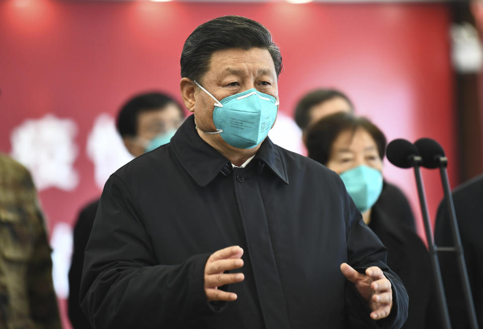 In this photo released by China's Xinhua News Agency, Chinese President Xi Jinping talks by video with patients and medical workers at a hospital in Wuhan, China, on March 10. (Xie Huanchi/Xinhua via AP)