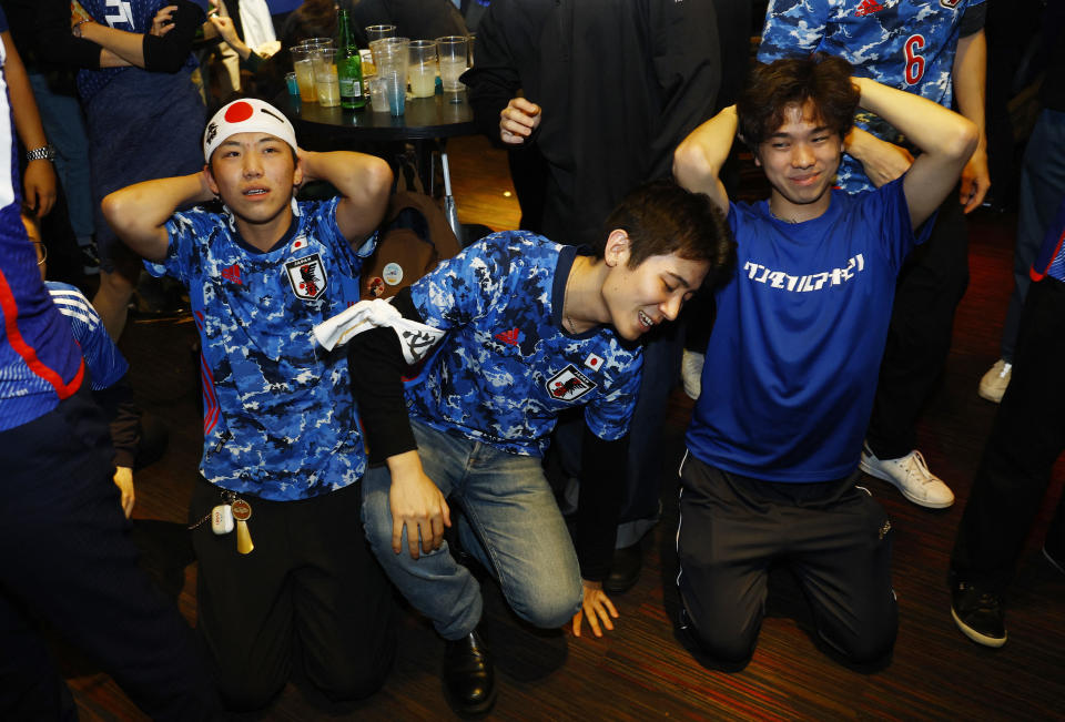 Soccer Football - FIFA World Cup Qatar 2022 - Fans in Tokyo watch Japan v Croatia - Tokyo, Japan - December 6, 2022  Japan fans look dejected at the Bee bar after the penalty shootout as Japan are eliminated from the World Cup REUTERS/Kim Kyung-Hoon