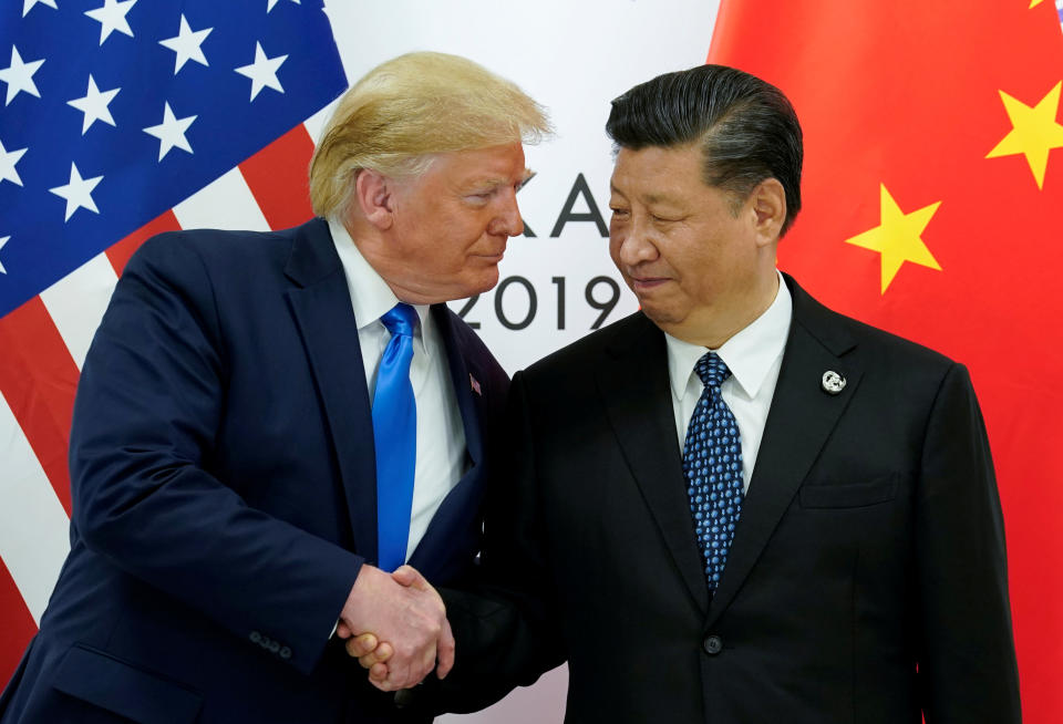 Photo shows US President Donald Trump shaking hands with China's President Xi Jinping.