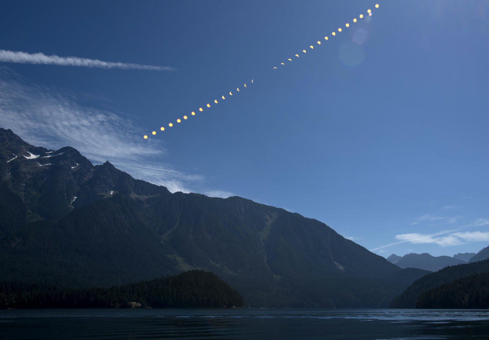 In this NASA handout composite image,  the progression of a partial solar eclipse Aug. 21, 2017 over Ross Lake, in Northern Cascades National Park, Washington. / Credit: Bill Ingalls/NASA / Getty Images