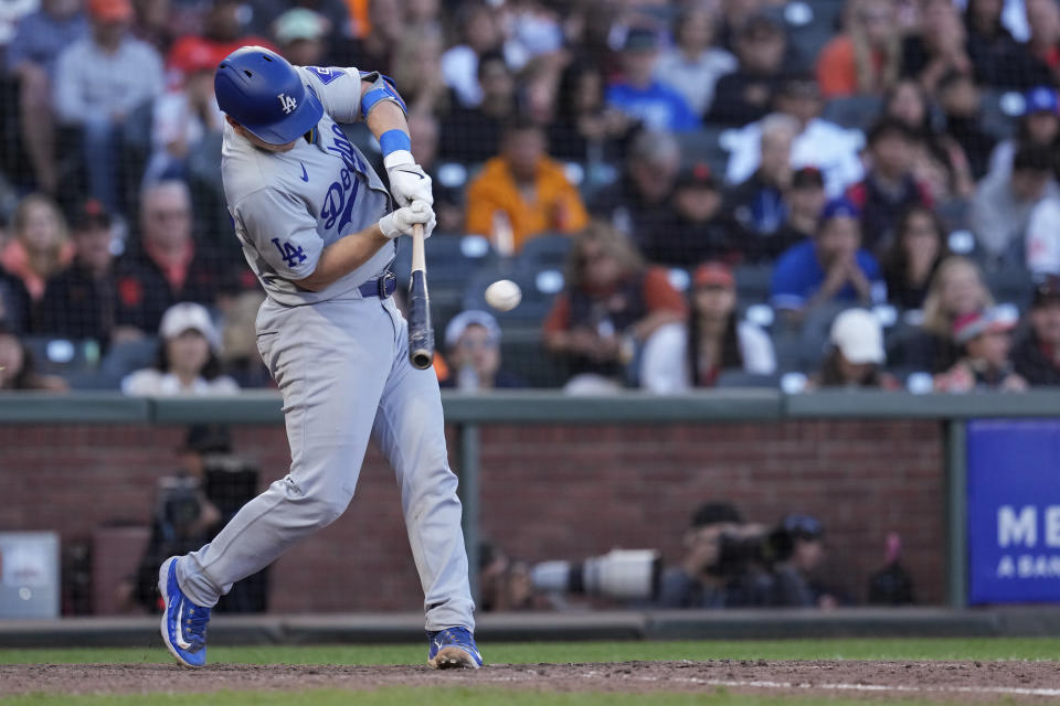 Los Angeles Dodgers' Will Smith hits a two-run double against the San Francisco Giants during the 11th inning of a baseball game Saturday, June 29, 2024, in San Francisco. (AP Photo/Godofredo A. Vásquez)