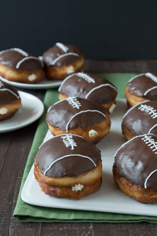 <p>The First Year Blog</p><p><strong>Get the recipe: </strong><a href="https://thefirstyearblog.com/cream-filled-chocolate-football-donuts/" rel="nofollow noopener" target="_blank" data-ylk="slk:Cream-Filled Chocolate Football Donuts;elm:context_link;itc:0;sec:content-canvas" class="link rapid-noclick-resp"><strong>Cream-Filled Chocolate Football Donuts</strong></a></p>
