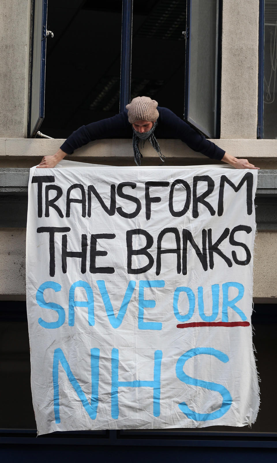 Protestors Occupy An Empty Office Block Owned By UBS In Central London