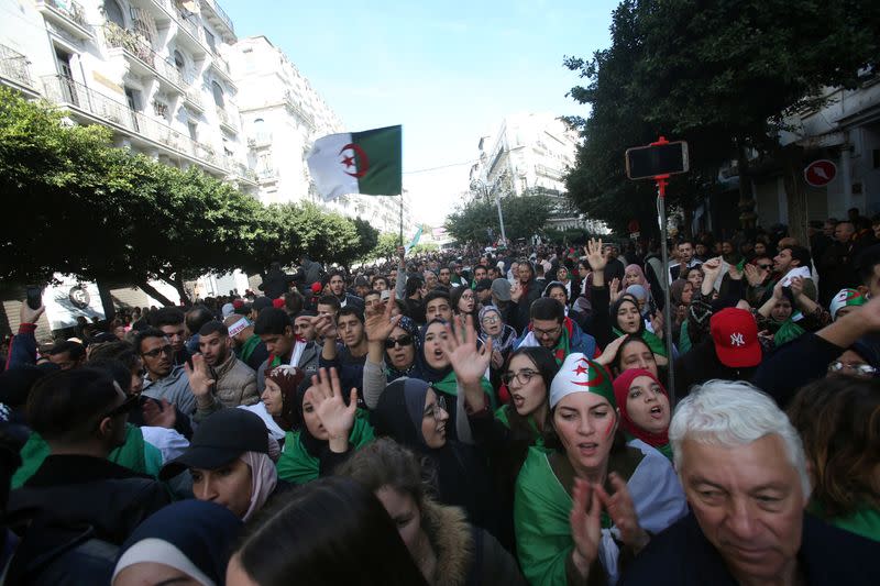 Demonstrators shout slogans during a protest to reject the presidential election in Algiers