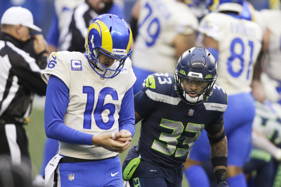 Seattle Seahawks strong safety Jamal Adams (33) looks at Los Angeles Rams quarterback Jared Goff during the second half of an NFL wild-card playoff football game, Saturday, Jan. 9, 2021, in Seattle. (AP Photo/Scott Eklund)