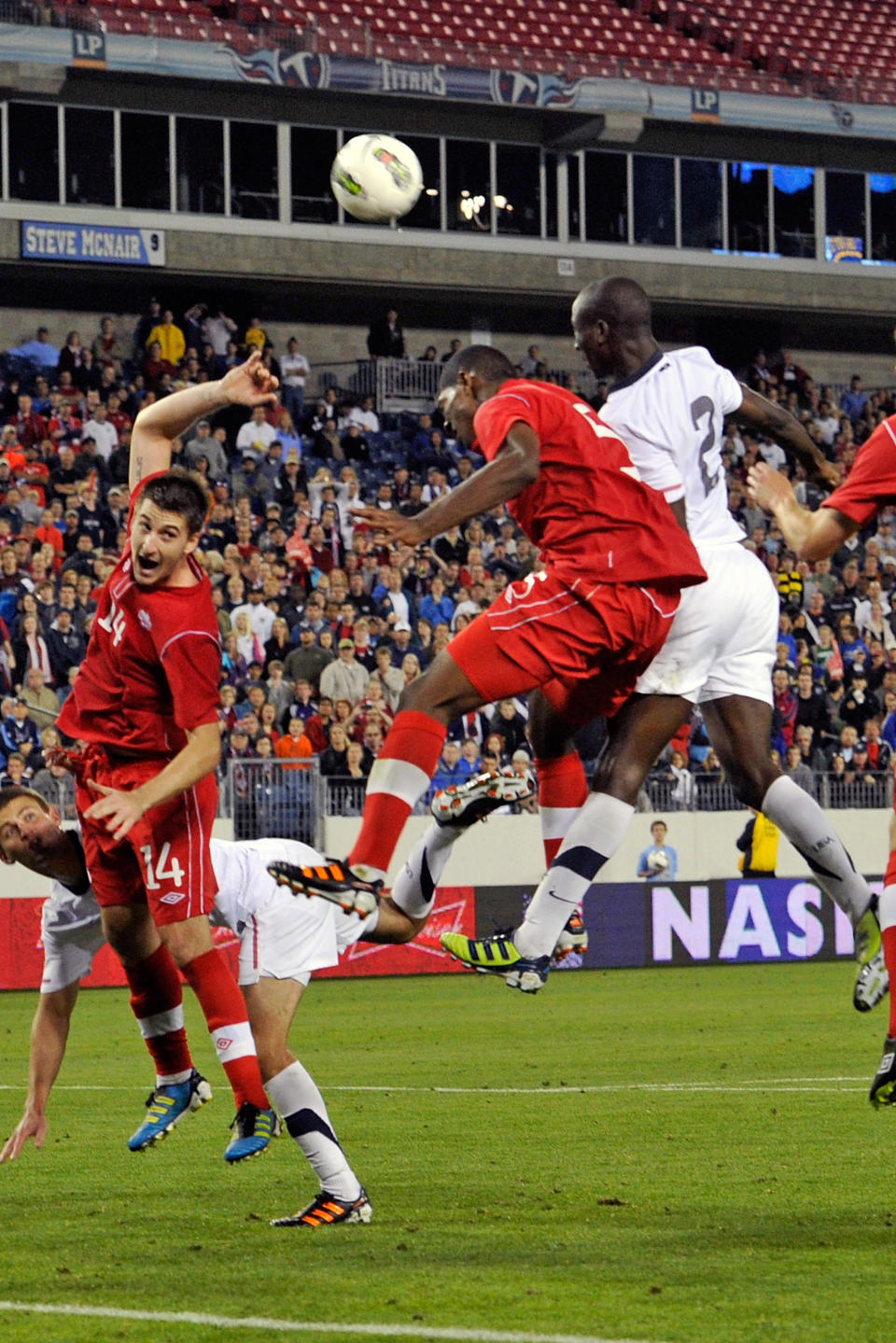 NASHVILLE, TN - MARCH 24: Doneil Henry #5 of Canada and Ike Opara #2 of the USA jump for a ball in a 2012 CONCACAF Men's Olympic Qualifying match at LP Field on March 24, 2012 in Nashville, Tennessee. (Photo by Frederick Breedon/Getty Images)