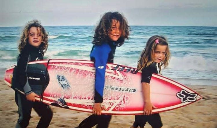 At about 5 years old, Caroline Marks, right, was already leading the way to the ocean with brothers Zach, left, and Luke, center, in Melbourne Beach. (Family photo)