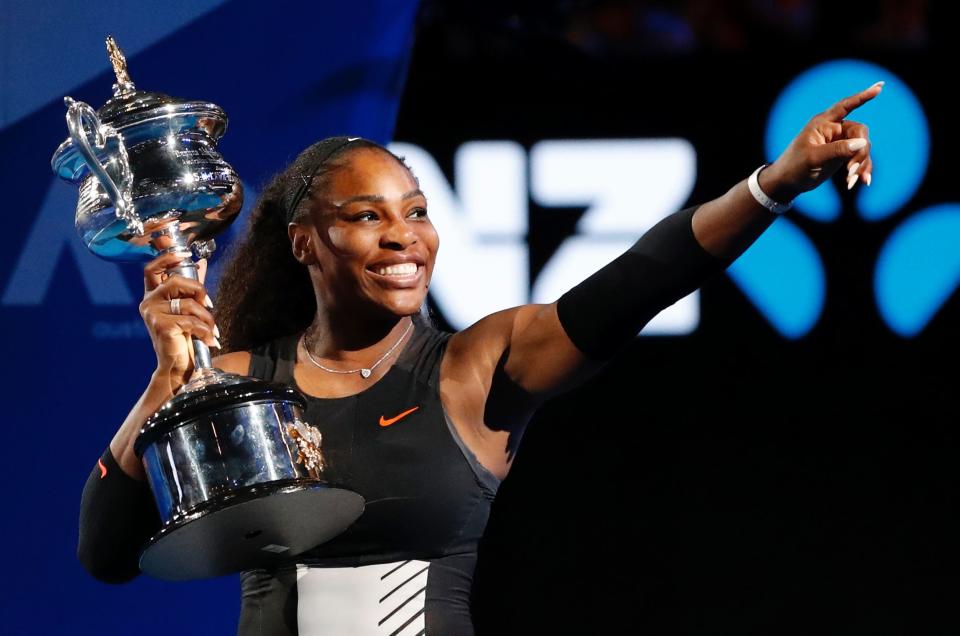 Serena Williams poses with her trophy after winning the 2017 Australian Open.