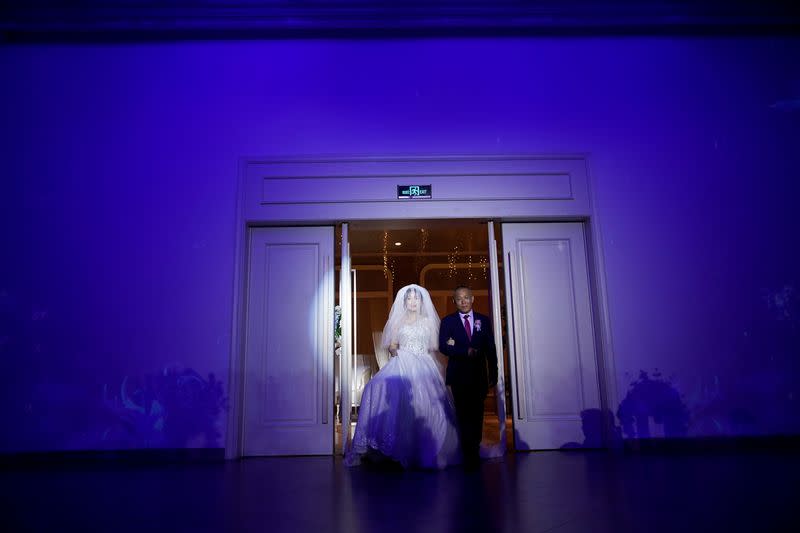 The Wider Image: Coronavirus dampens celebrations in China's wedding gown city