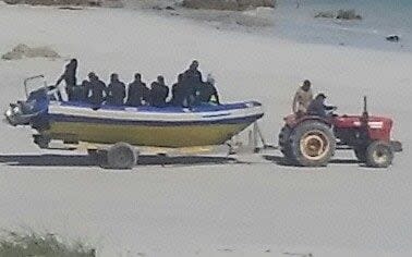 Suspected poachers arrive on a beach in South Africa