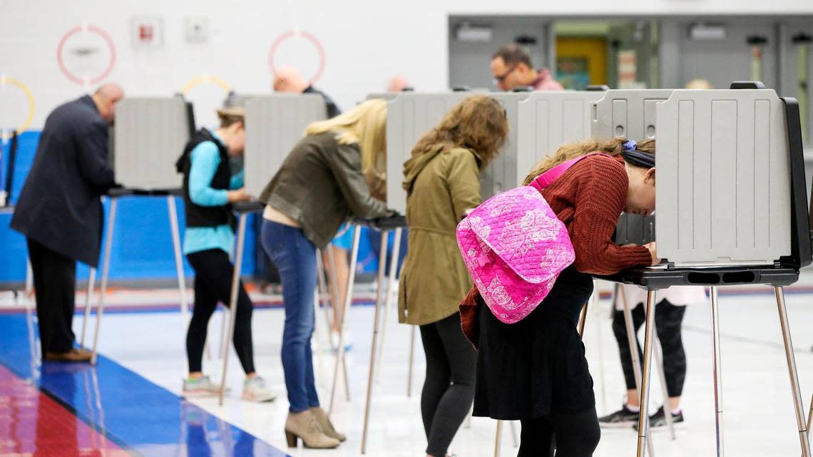 People vote at Veterans Park Elementary School in Lexington, Ky., on election day, Tuesday, Nov. 8, 2022.