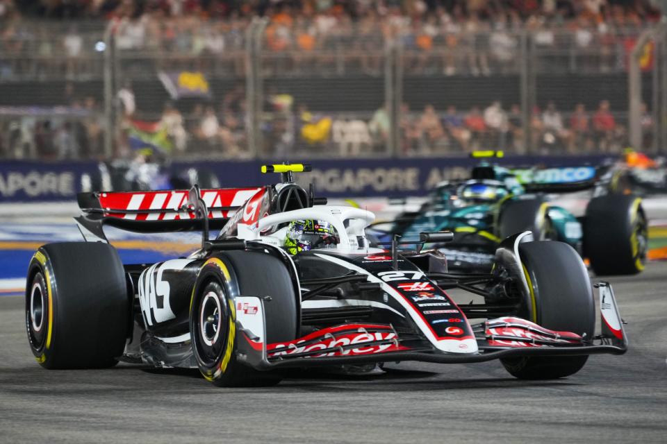 Haas driver Nico Hulkenberg of Germany steers his car during the Singapore Formula One Grand Prix at the Marina Bay Street Circuit, in Singapore, Sunday, Sept. 22, 2024. (AP Photo/Vincent Thian)