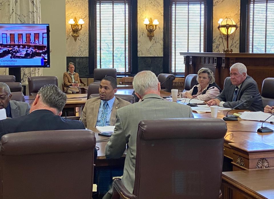 At the far right, Mississippi Sen. Kevin Blackwell, R-Southaven, listens to Sen. John Horhn, D-Jackson, as he asks questions about a Medicaid expansion bill that passed through the Senate Medicaid Committee Wednesday at the State Capitol building. The committee moved forward House Bill 1725, albeit with an amendment to change the bill's key provisions with more "conservative" versions, Blackwell said.