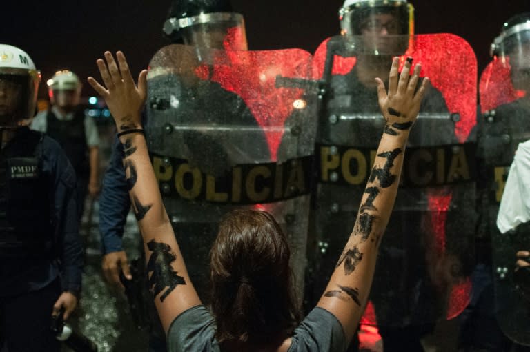 Demonstrators protest against Brazilian President Michel Temer in Brasilia on May 18, 2017