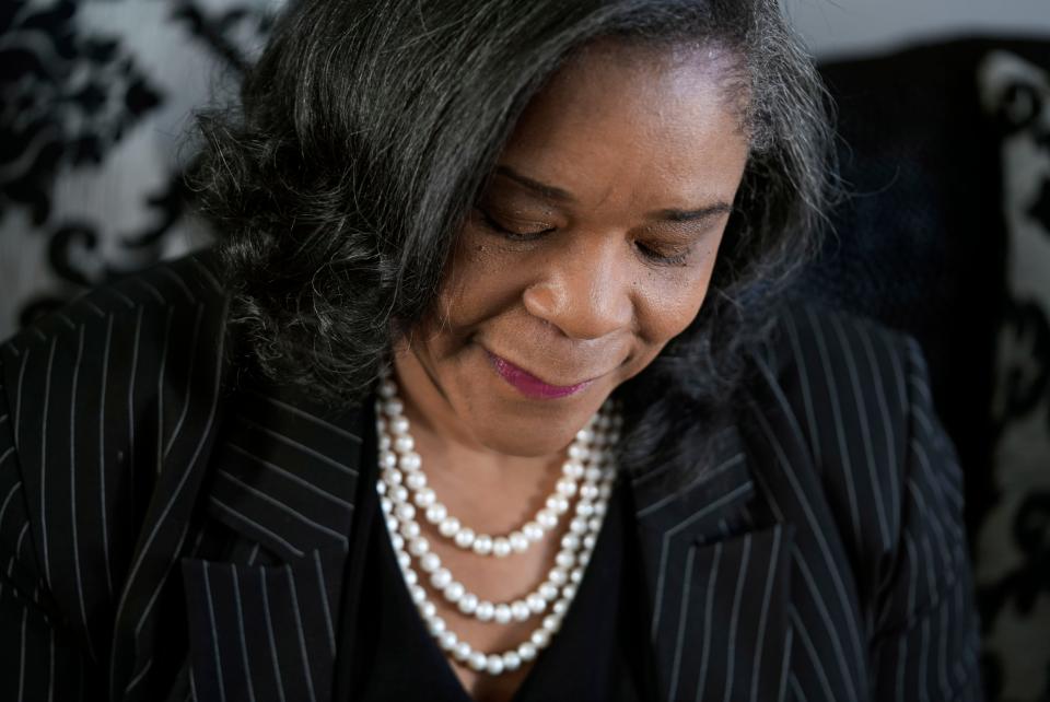 Carolyn Williams Francis holds a photo of her and her sister Carla Bailey who passed away last year from breast cancer. In 2012, Francis went to the hospital after feeling shortness of breath while exercising and prevented her own heart attack.