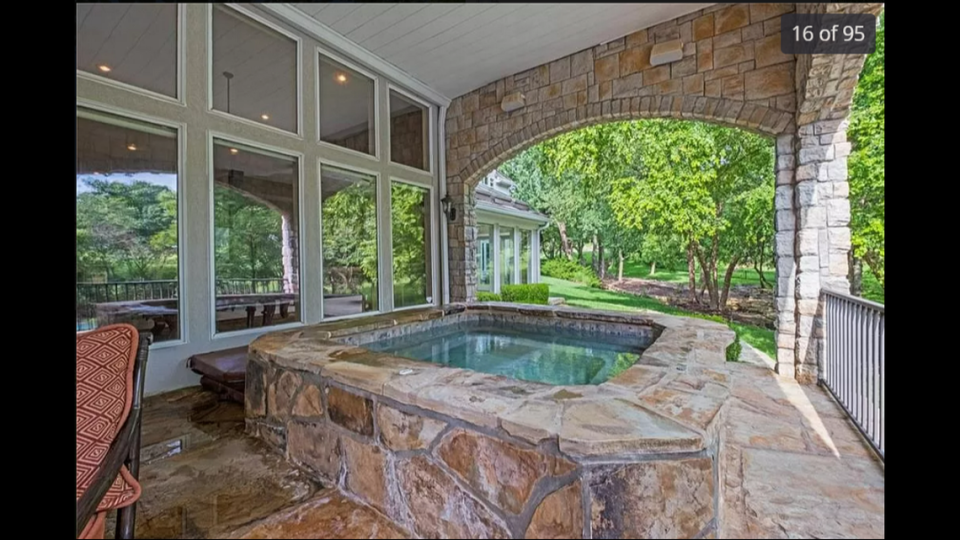 The home at 425 NE St. Andrews Circle in Lee’s Summit has a hot tub that sits next to the outdoor kitchen.