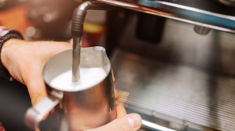 barista steaming milk