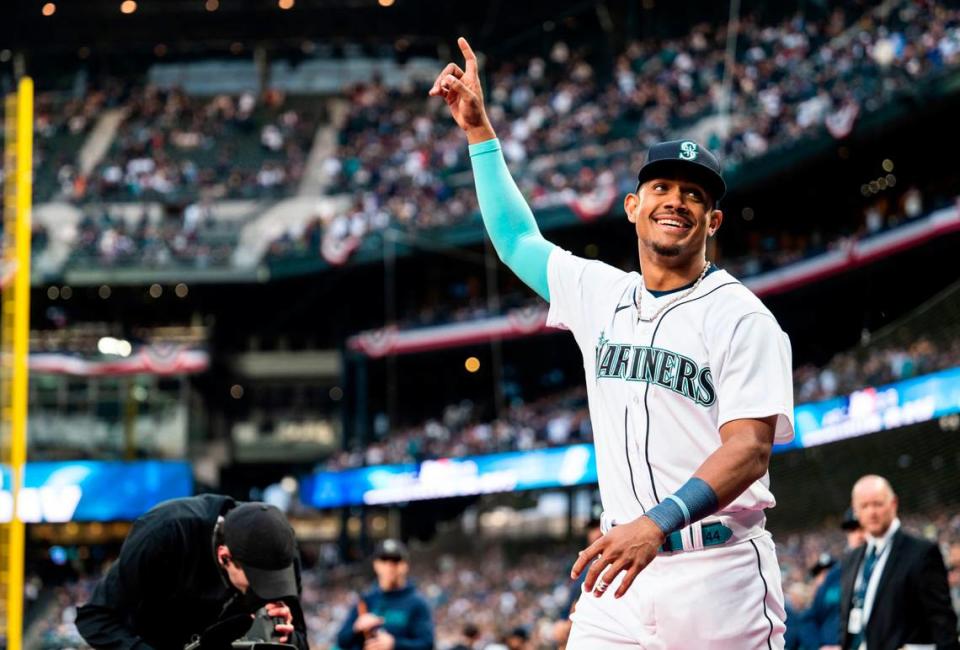 Seattle Mariners center fielder Julio Rodriguez (44) walks onto the field to accept the Silver Slugger and AL Rookie of the Year awards during the opening ceremony before the start of the Mariners home opener against the Cleveland Guardians at T-Mobile Park in Seattle on Thursday, March 30, 2023.