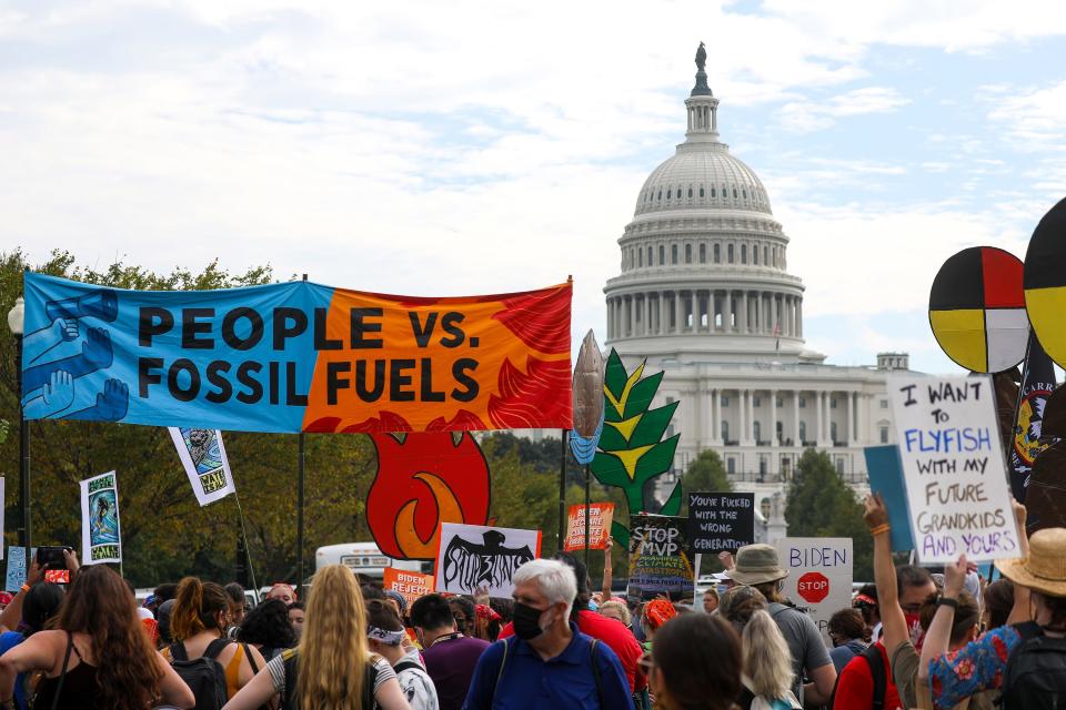 WASHINGTON, DC - OCTOBER 15: Native and other environmentalist groups gather outside the US Capitol on the fifth day of "People vs. Fossil Fuels" protests in Washington, DC, United States on October 15, 2021. Protesters hold banners demanding the U.S. President Joe Biden to reject fossil fuel projects and declare a climate emergency while police take security measures. (Photo by Yasin Ozturk/Anadolu Agency via Getty Images)