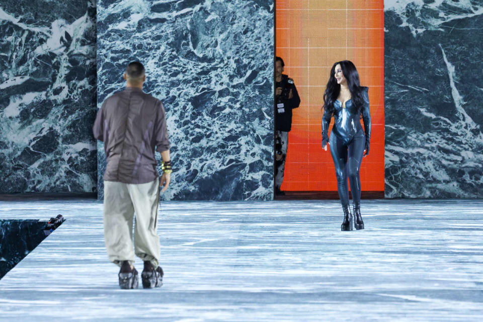 PARIS, FRANCE - SEPTEMBER 28: (EDITORIAL USE ONLY - For Non-Editorial use please seek approval from Fashion House) American singer Cher (R) walks next to French fashion designer Olivier Rousteing on the runway at the Balmain Womenswear Spring/Summer 2023 show as part of the Balmain Festival V03 during Paris Fashion Week on September 28, 2022 in Paris, France. (Photo by Peter White/Getty Images)