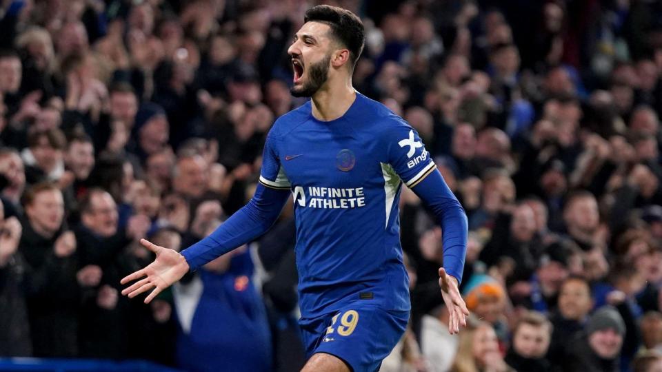 Armando Broja celebrates scoring for Chelsea.