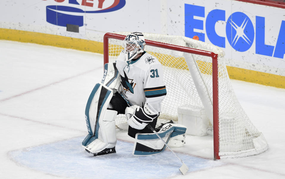 San Jose Sharks' goalie Martin Jones rests in his goal as the Minnesota Wild take a time-out in the third period of an NHL hockey game, Saturday, Feb. 15, 2020, in St. Paul, Minn. San Jose won 2-0.(AP Photo/Tom Olmscheid)