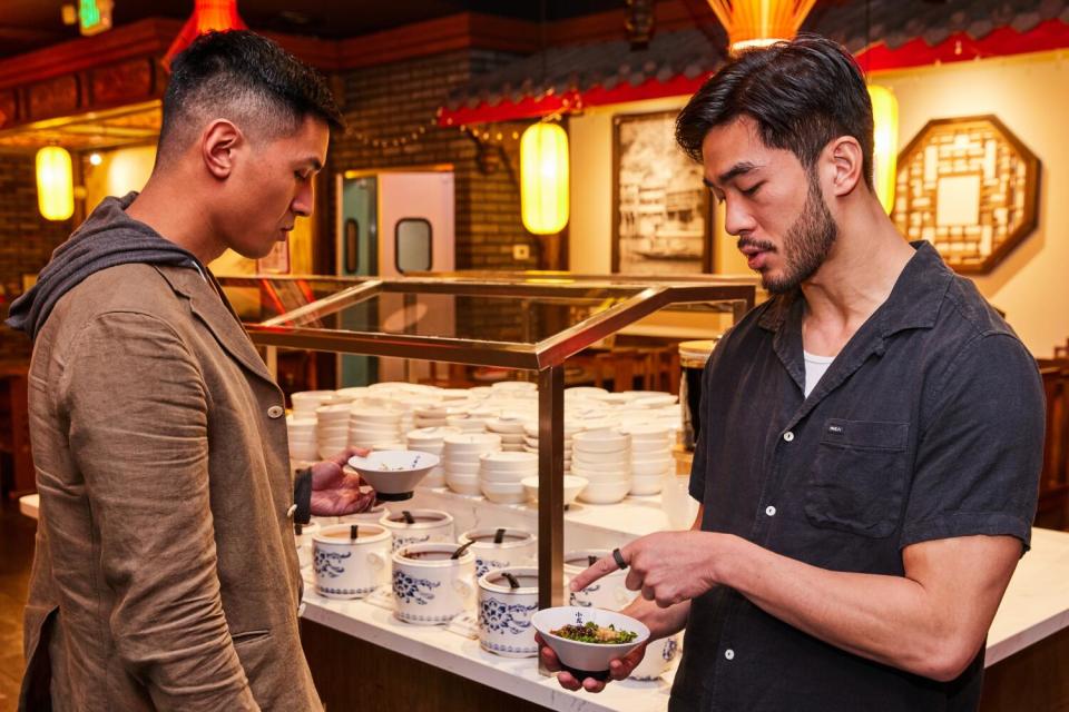 Byron Wu and Justin Chien discussing the sauce bar.