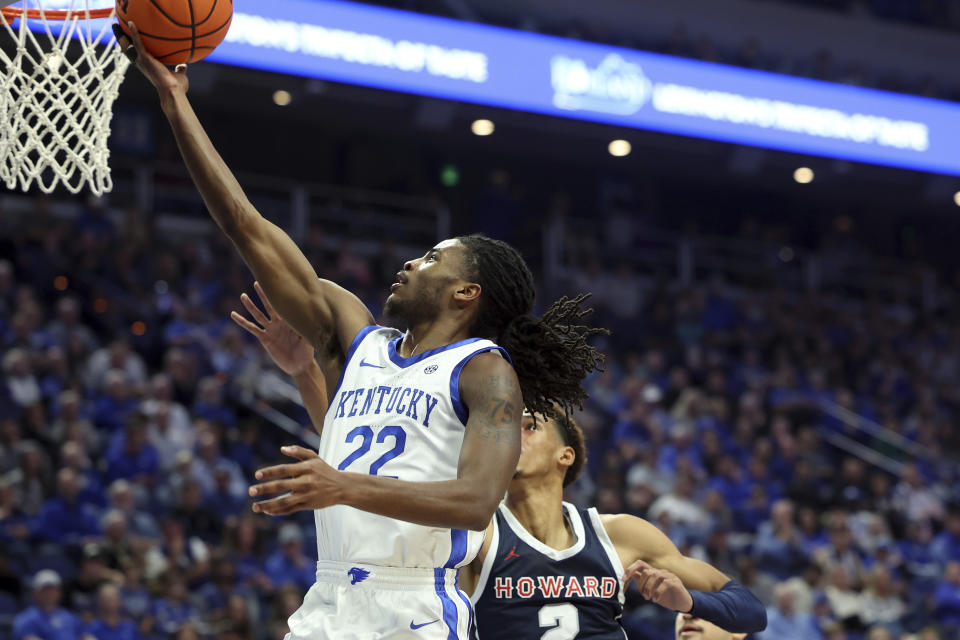 Kentucky's Cason Wallace (22) shoots next to Howard's Steve Settle III (2) during the first half of an NCAA college basketball game in Lexington, Ky., Monday, Nov. 7, 2022. (AP Photo/James Crisp)