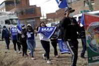 Supporters of the Movement to Socialism party (MAS) attend a rally a day after nationwide election in El Alto