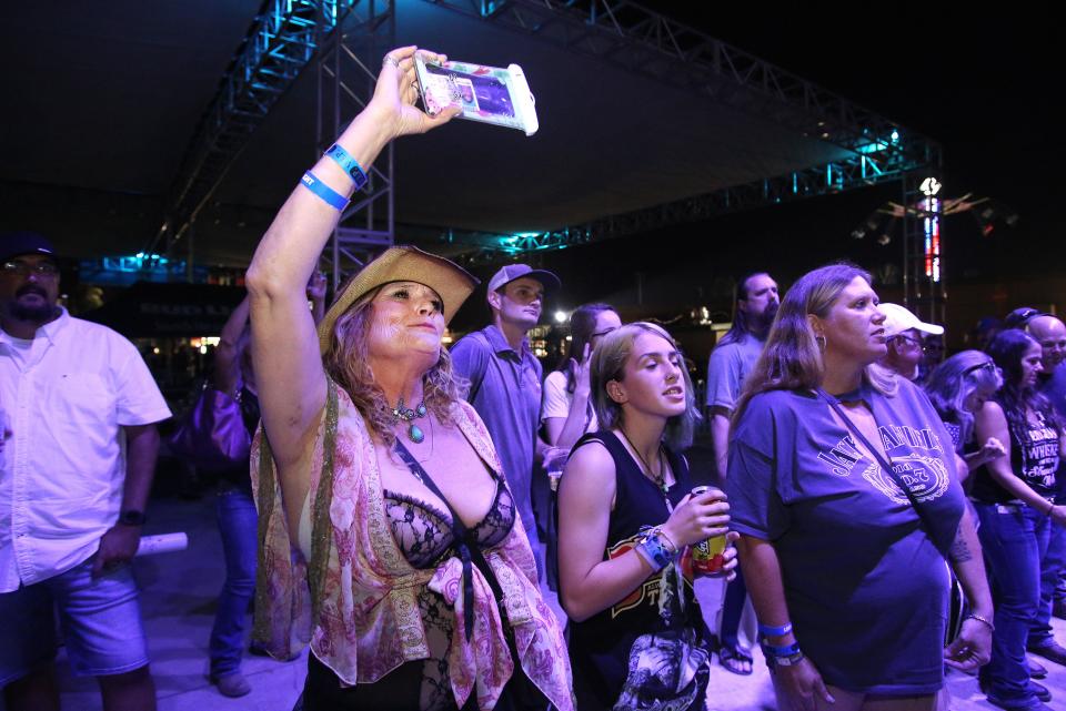 From left to right, Lisa Sampaulesi, Kalie Armstrong and Adrienne Jones enjoys the music of LOCASH, and American country music duo at the Tulare County Fair in Tulare, Calif., Thursday, Sept. 15, 2022.