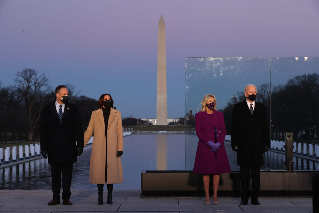 Douglas Emhoff, U.S. Vice President-elect Kamala Harris, Dr. Jill Biden and U.S. President-elect Joe Biden attend a memorial service to honor the nearly 400,000 American victims of the coronavirus pandemic at the Lincoln Memorial Reflecting Pool January 19, 2021 in Washington, DC. (Photo by Chip Somodevilla/Getty Images)