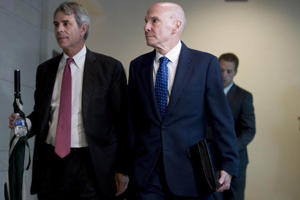 Michael McKinley, a former top aide to Secretary of State Mike Pompeo, right, arrives on Capitol Hill in Washington, Wednesday, Oct. 16, 2019, to testify before congressional lawmakers as part of the House impeachment inquiry into President Donald Trump. (AP Photo/Andrew Harnik)