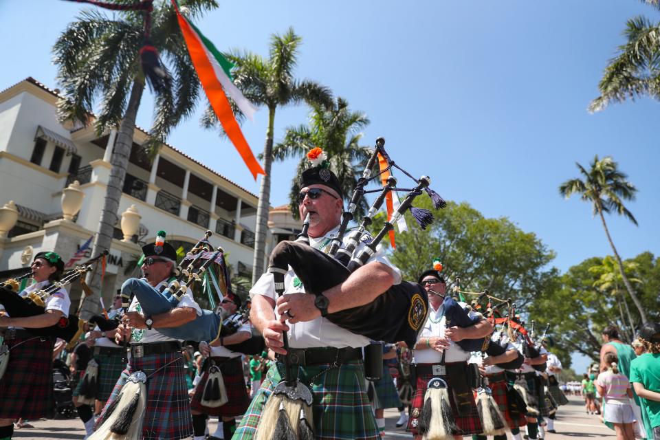 People attend the St. Patrick’s Day Parade in downtown Naples on Saturday, March 11, 2023. 