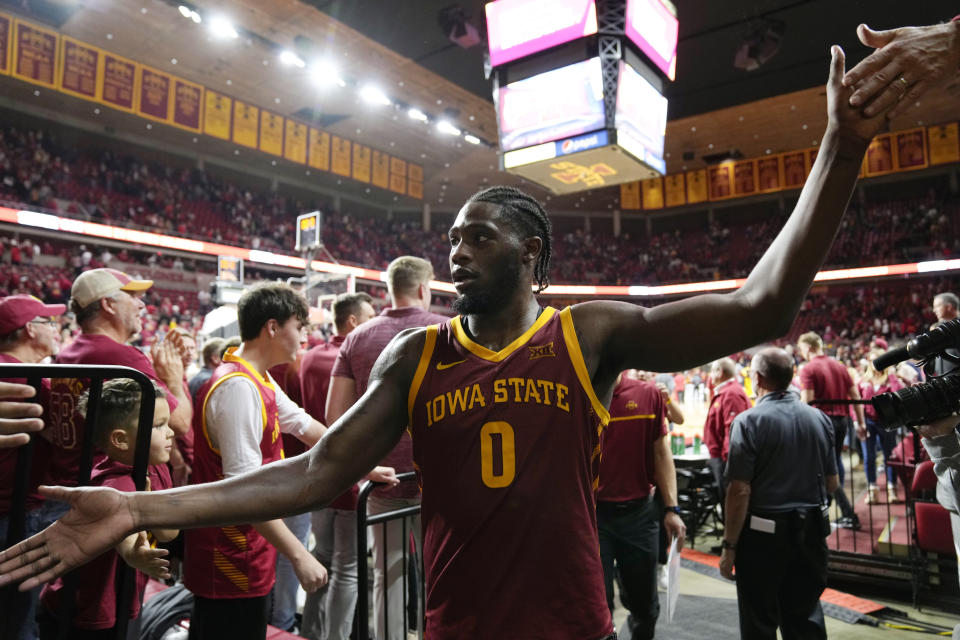 Iowa State forward Tre King (0) celebrates with fans as he walks off the court after an NCAA college basketball game against Iowa, Thursday, Dec. 7, 2023, in Ames, Iowa. Iowa State won 90-65. (AP Photo/Charlie Neibergall)