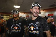 Houston Astros starting pitcher Bryan Abreu, left, and starting pitcher Justin Verlander celebrate in the locker room after winning Game 6 of baseball's American League Championship Series against the New York Yankees Sunday, Oct. 20, 2019, in Houston. The Astros won 6-4 to win the series 4-2. (AP Photo/Matt Slocum)
