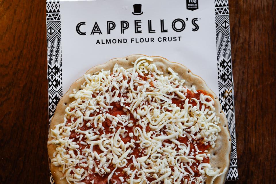 Capello's pizza with box.